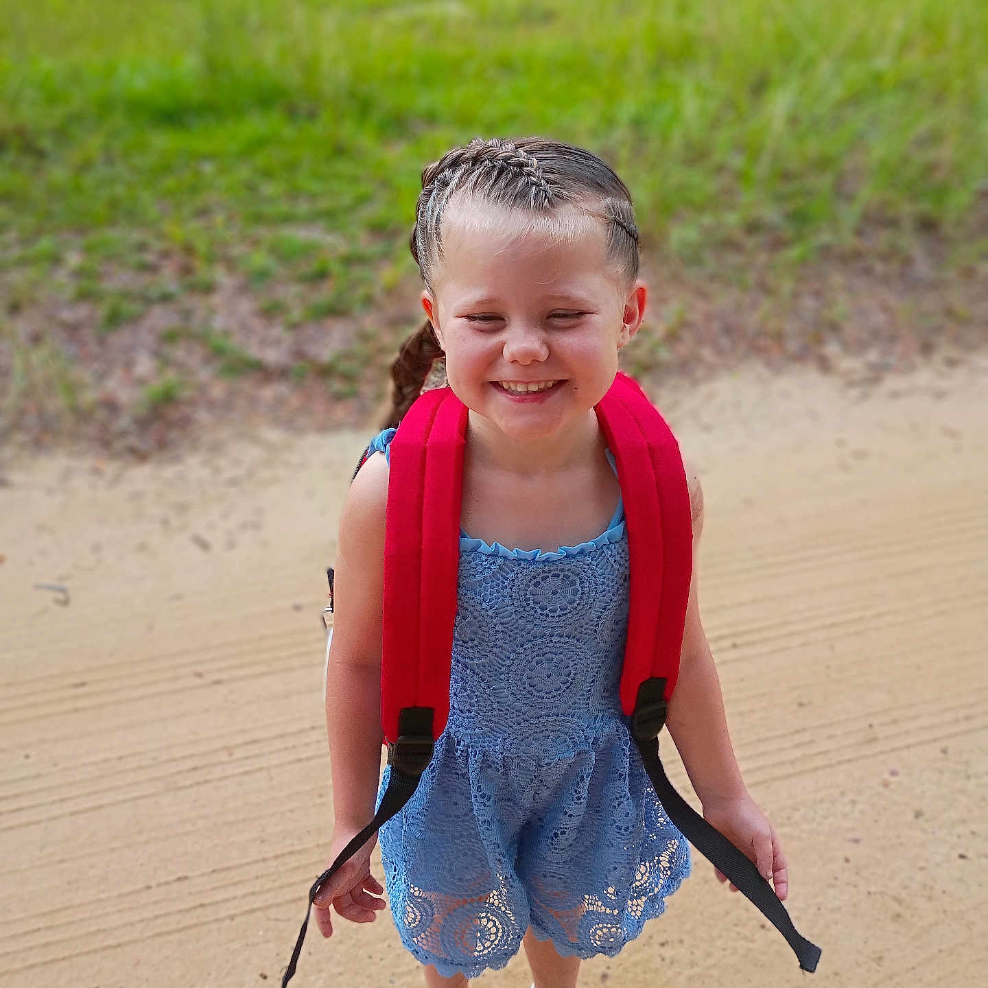 Aymiee joined the competition — help win amazing prizes! blue_dress, braided_hair, child, cute, daylight, fashion, feet, girl, grass, happy, lace, nature, outdoor, portrait, red_backpack, sandals, sandy_path, smiling, standing, summer