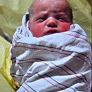 Tristan is registered to the contest to win money with this photo: newborn, baby, infant, wrapped, blanket, striped_blanket, hospital, face, head, skin, human, child, sleepy, cute, swaddled, closeup, indoors, person, portrait, young