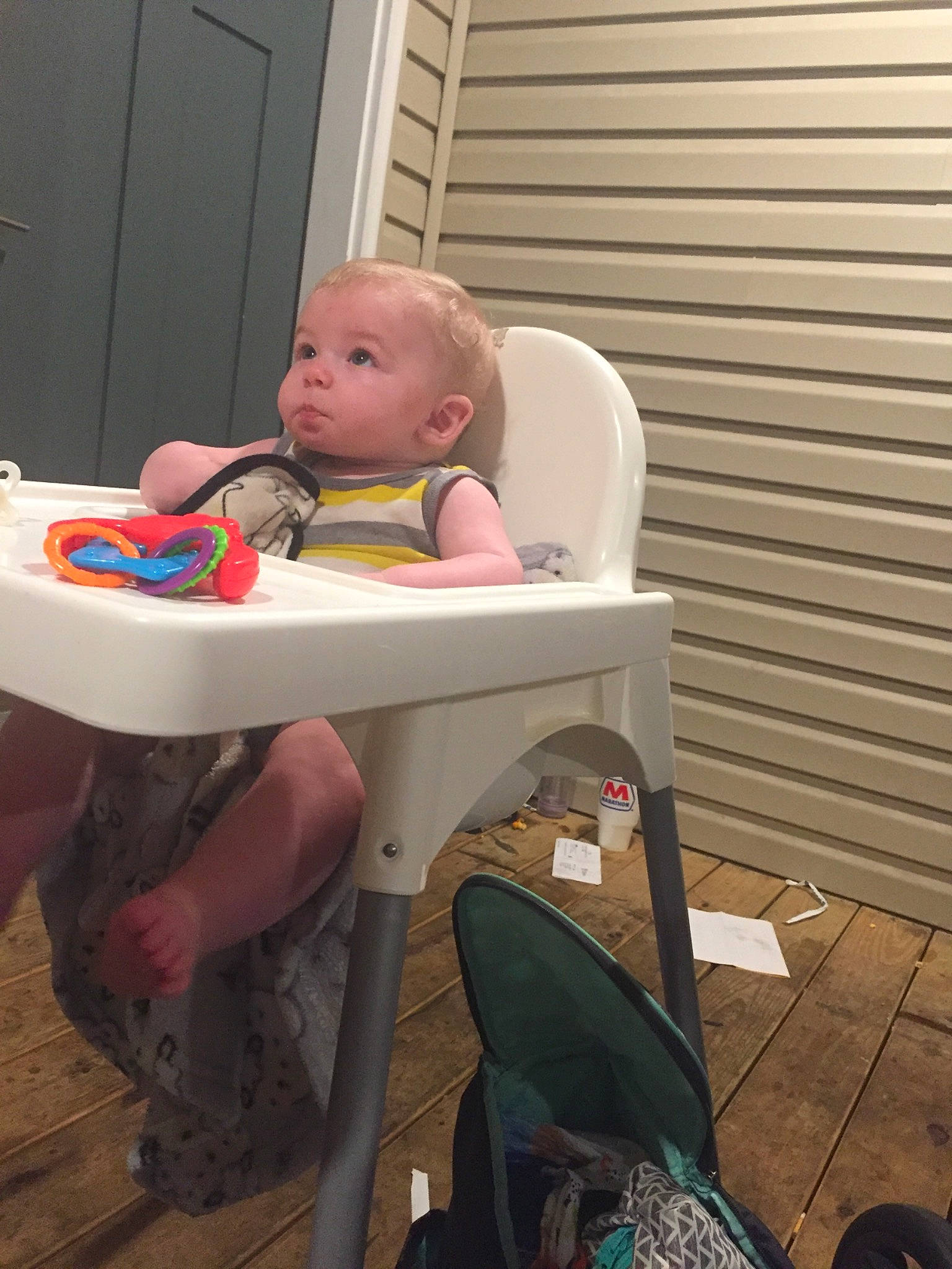 Brett is registered to the contest to win money with this photo: baby, baby_products, baby_safety, baby_toddler_clothing, chair, child, comfort, flooring, fun, leisure, person, personal_protective_equipment, play, room, sandal, sitting, table, toddler, vacation, wood