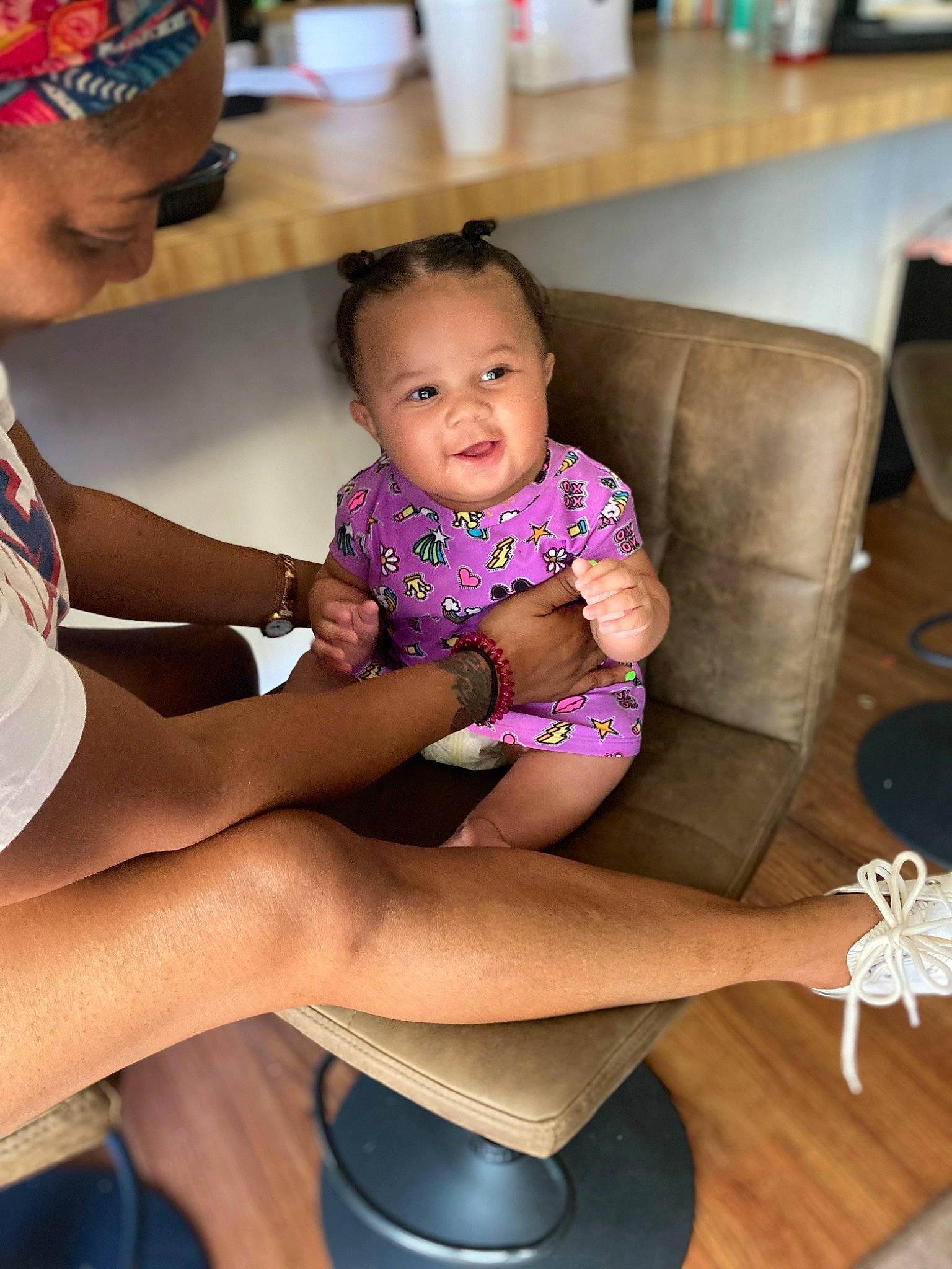 Harmoni joined the competition — help win amazing prizes! beauty, child, event, floor, flooring, fun, hairstyle, happy, human_leg, knee, lap, leg, leisure, person, shorts, skin, smile, sock, thigh, toddler