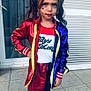 child, costume, harley_quinn, face_paint, pigtails, jacket, red, blue, yellow, skirt, tights, outdoors, expression, portrait, serious, standing, window, tiles, person, young