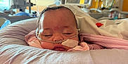 Esmari is registered to the contest to win money with this photo: baby, bandage, blanket, care, child, closeup, face, healthcare, hospital, indoor, medical, medical_equipment, monitor, nursery, patient, person, pillow, rest, sleeping, tube