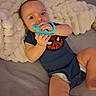 Aryez joined the competition — help win amazing prizes! baby, child, infant, portrait, lying_down, smiling, pacifier, toy, blanket, bed, indoor, spiderman_shirt, blue_clothing, diaper, hands, face, eyes, fluffy, cozy, photography