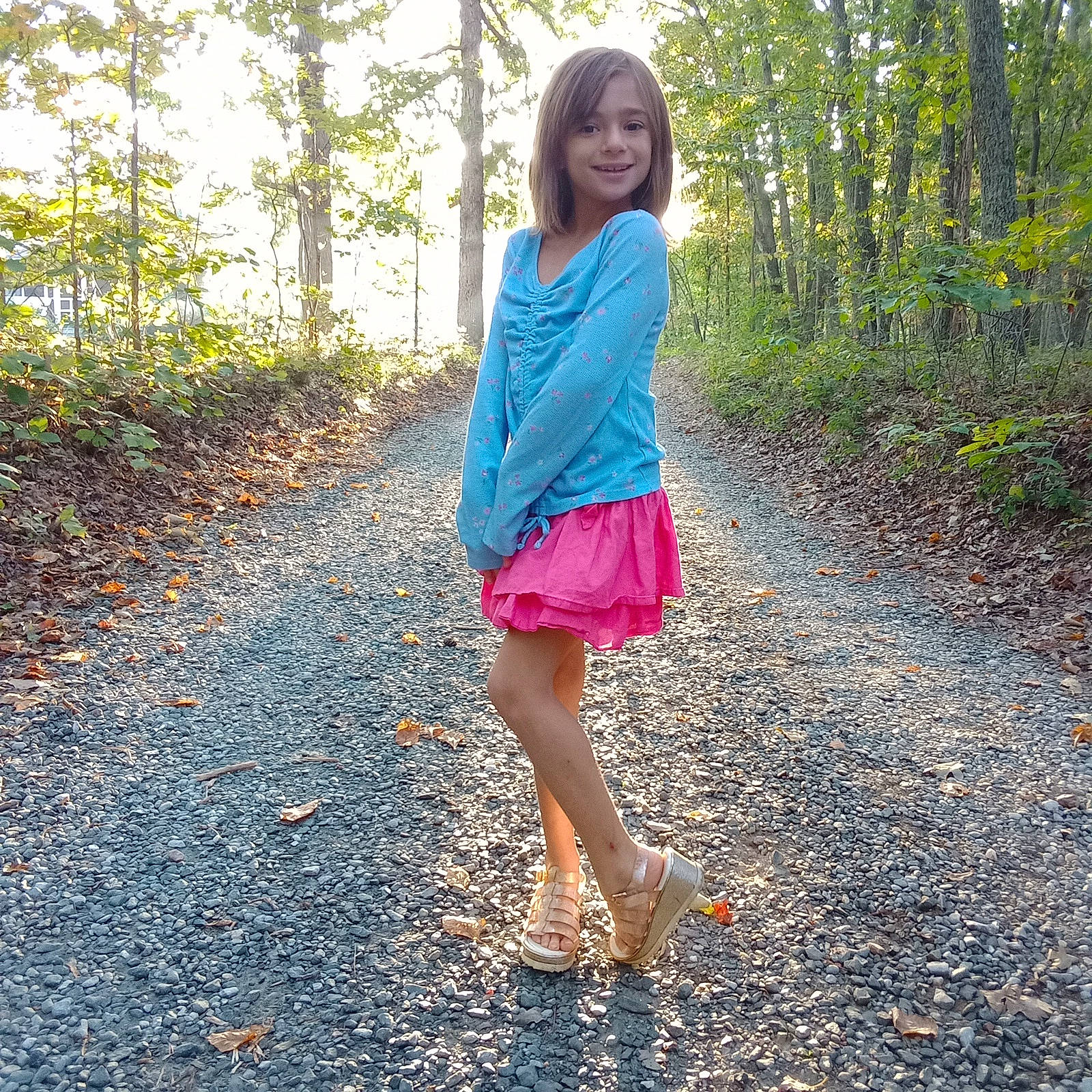 Addilyn is registered to the contest to win money with this photo: calf, day_dress, electric_blue, footwear, forest, grass, human_leg, joy, knee, magenta, pattern, people_in_nature, person, plant, sandal, sleeve, smile, thigh, tree, waist