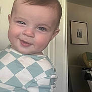 Mac joined the competition — help win amazing prizes! baby, child, smile, face, indoors, portrait, clothing, green, white, checkered, furniture, wall, picture_frame, skin, hair, cute, happy, person, infant, toddler