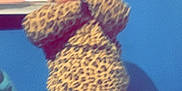 Clariece joined the competition — help win amazing prizes! baby, leopard_print, clothing, child, standing, blue_wall, towel, indoor, person, blurred, covering_face, young_child, infant, patterned_clothing, fabric, soft_toys, bed, home, casual, cute