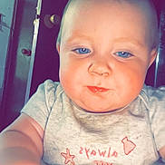 Clariece joined the competition — help win amazing prizes! baby, child, blue_eyes, face, arm, shirt, indoor, door, light_gray, red_text, chubby_cheeks, closeup, person, young_child, portrait, cute, infant, looking_down, hand, expression