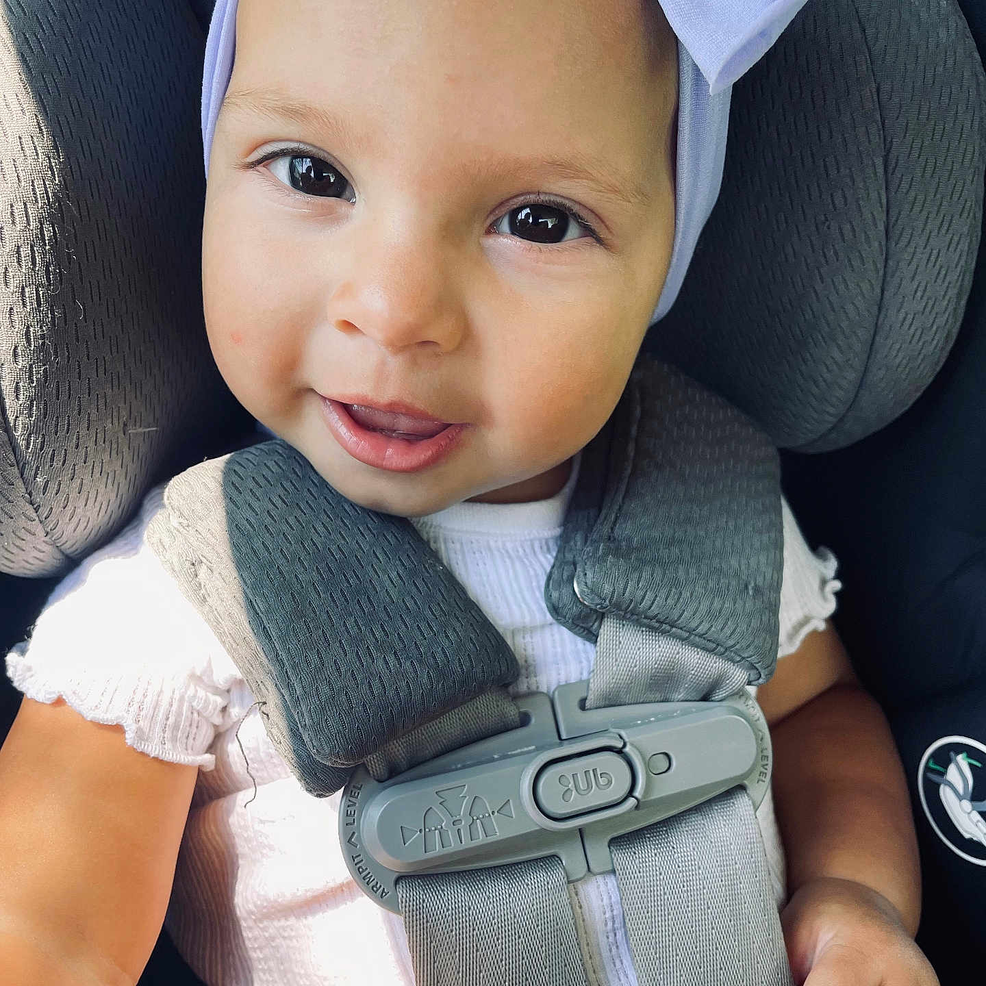 Skyla is registered to the contest to win money with this photo: accessories, baby, belt, bodypart, car, clothing, cushion, face, finger, hand, happy, hat, head, homedecor, person, photography, portrait, transportation, vehicle, vest