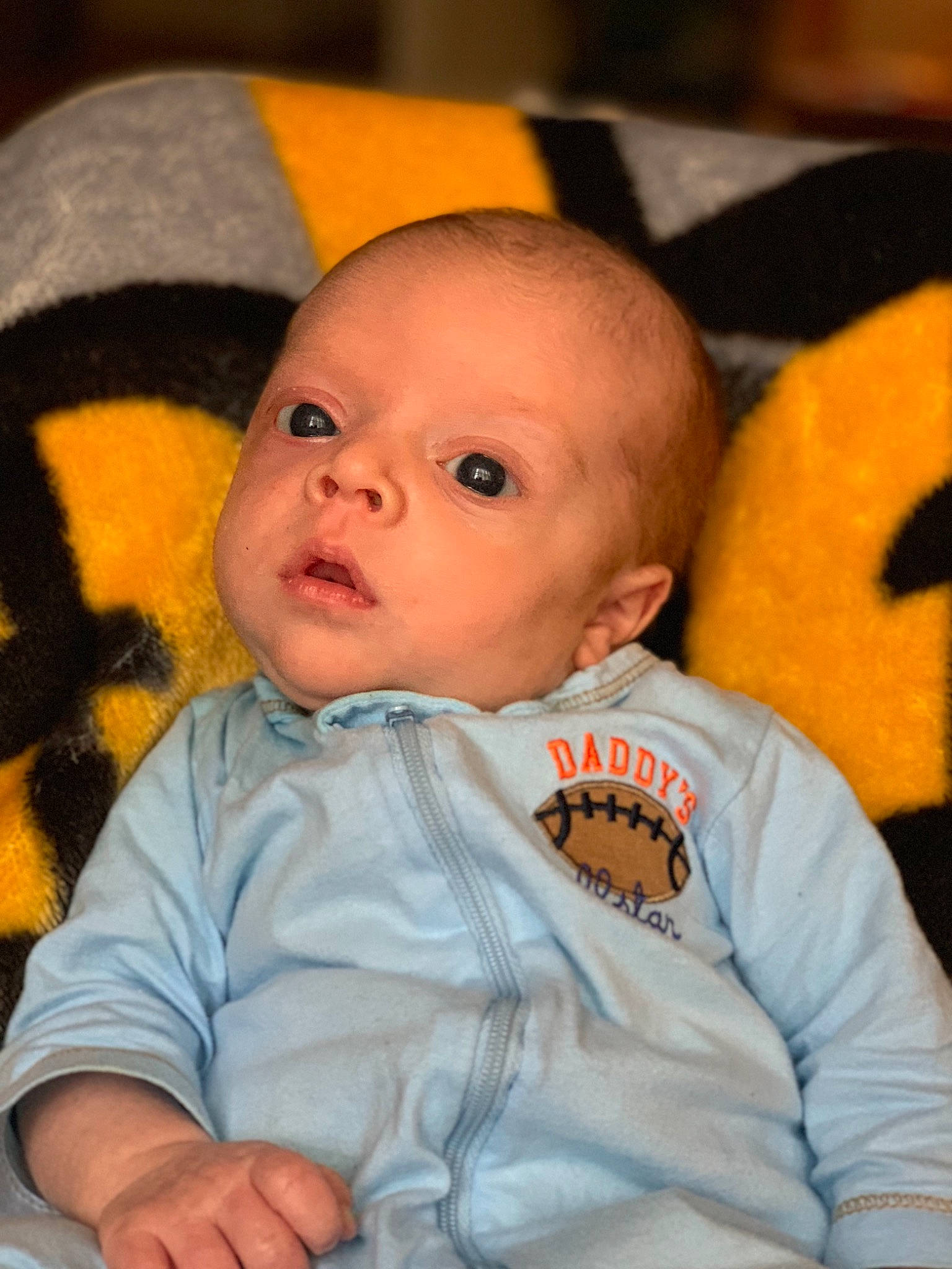 Maddux is registered to the contest to win money with this photo: boy, cheek, child, chin, eye, face, finger, forehead, fun, head, infant, iris, mouth, nose, person, product, skin, smile, toddler, yellow