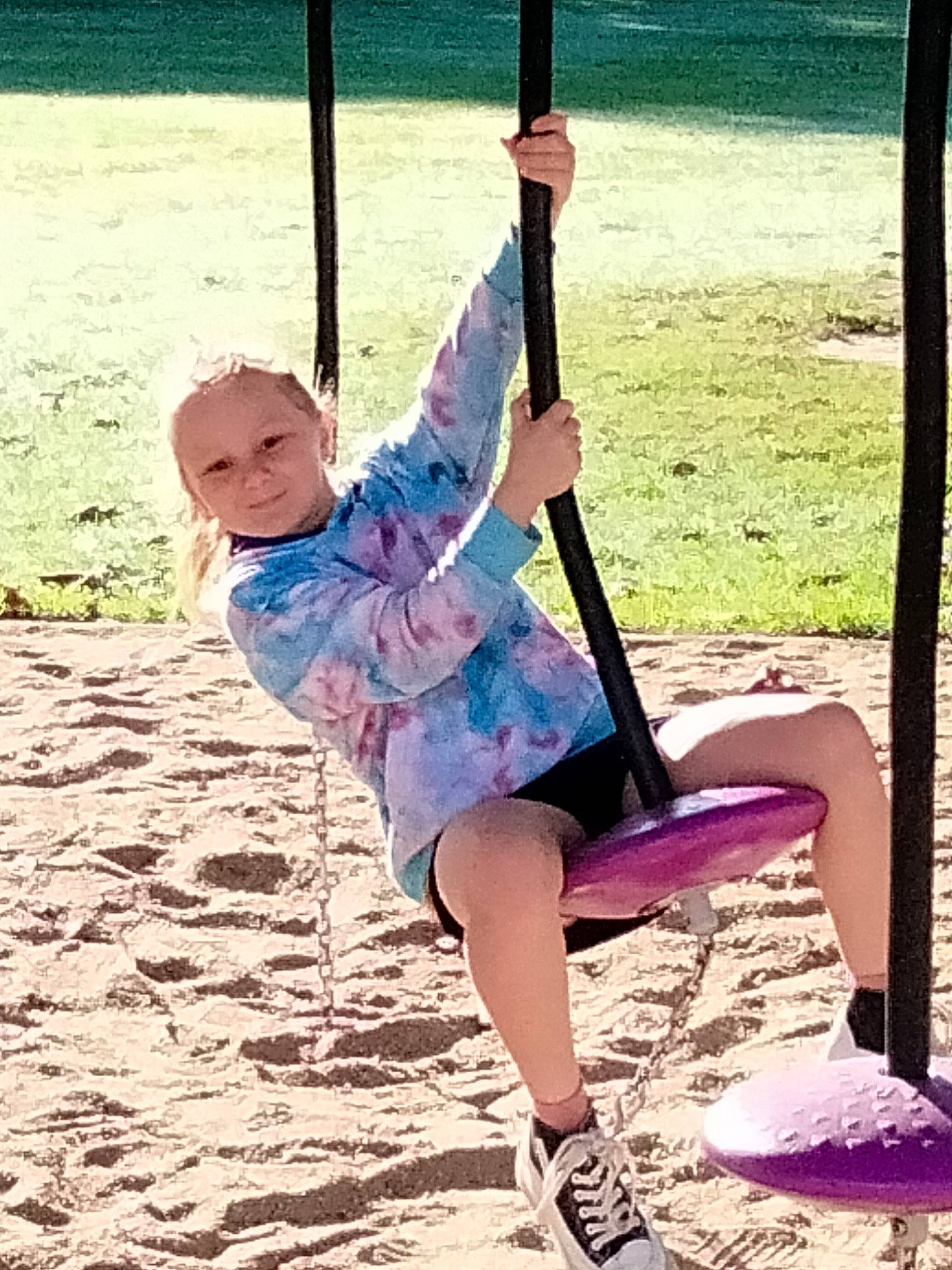Amber is registered to the contest to win money with this photo: baby, baby_toddler_clothing, balance, child, fun, happy, knee, leisure, outdoor_play_equipment, people_in_nature, person, play, playground, recreation, shade, shorts, sitting, smile, swing, thigh