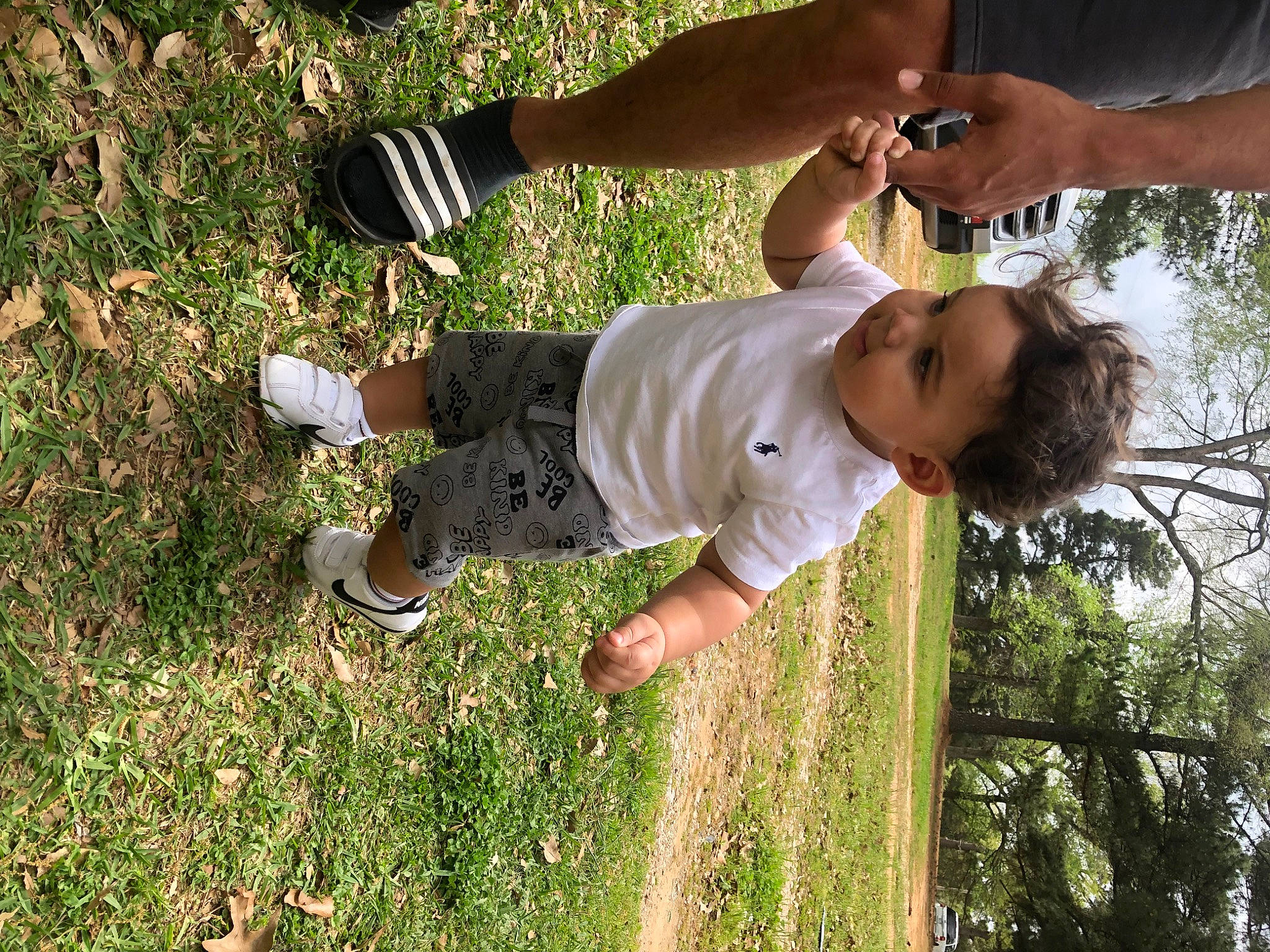 Korbyn joined the competition — help win amazing prizes! arm, elbow, finger, foot, fun, gesture, grass, hand, happy, human_leg, knee, leisure, light, people_in_nature, person, plant, shorts, thumb, toddler, tree