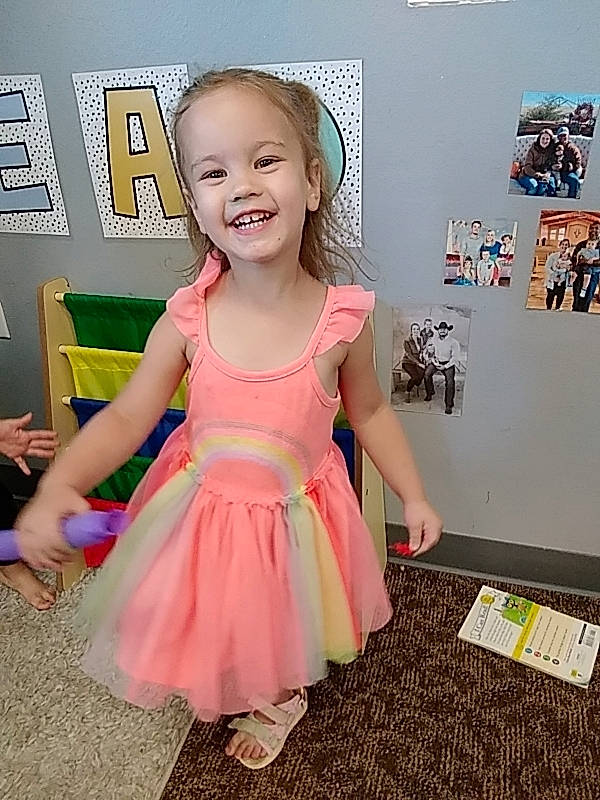 Kynlee joined the competition — help win amazing prizes! baby_toddler_clothing, child, day_dress, design, dress, event, fashion_accessory, flooring, fun, happy, joy, magenta, pattern, person, pink, play, purple, room, sandal, sleeve
