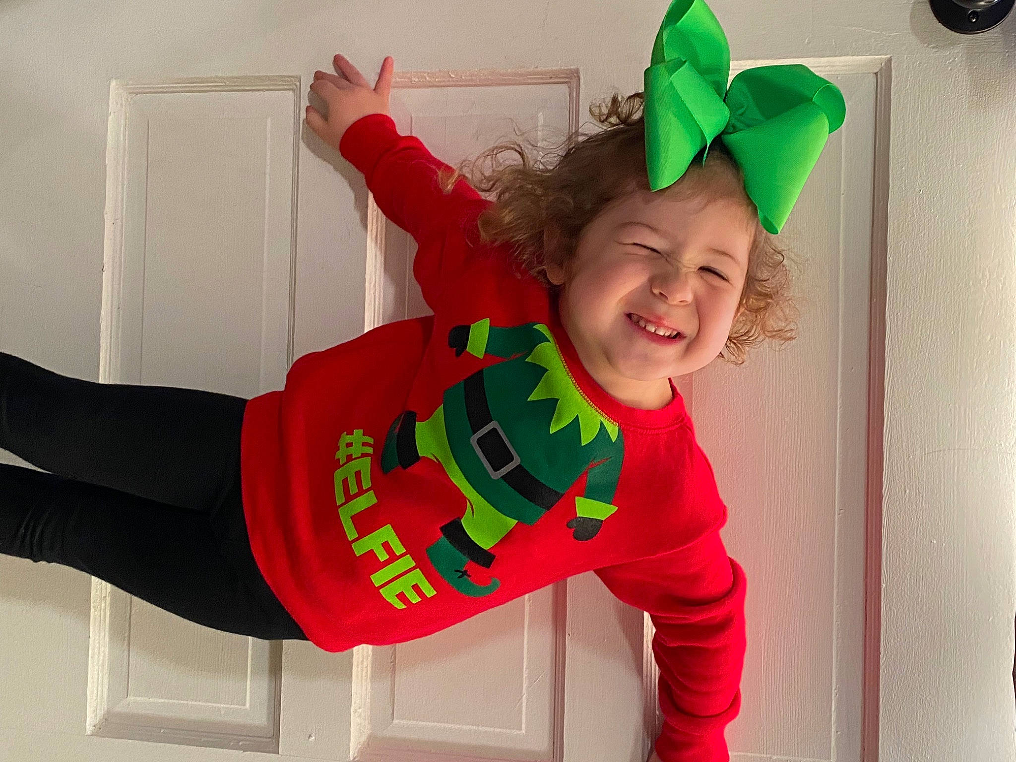 Dawsyn is registered to the contest to win money with this photo: baby_toddler_clothing, child, costume, costume_hat, event, fun, green, happy, holiday, jersey, joy, magenta, person, pink, red, shorts, sleeve, smile, sportswear, t_shirt