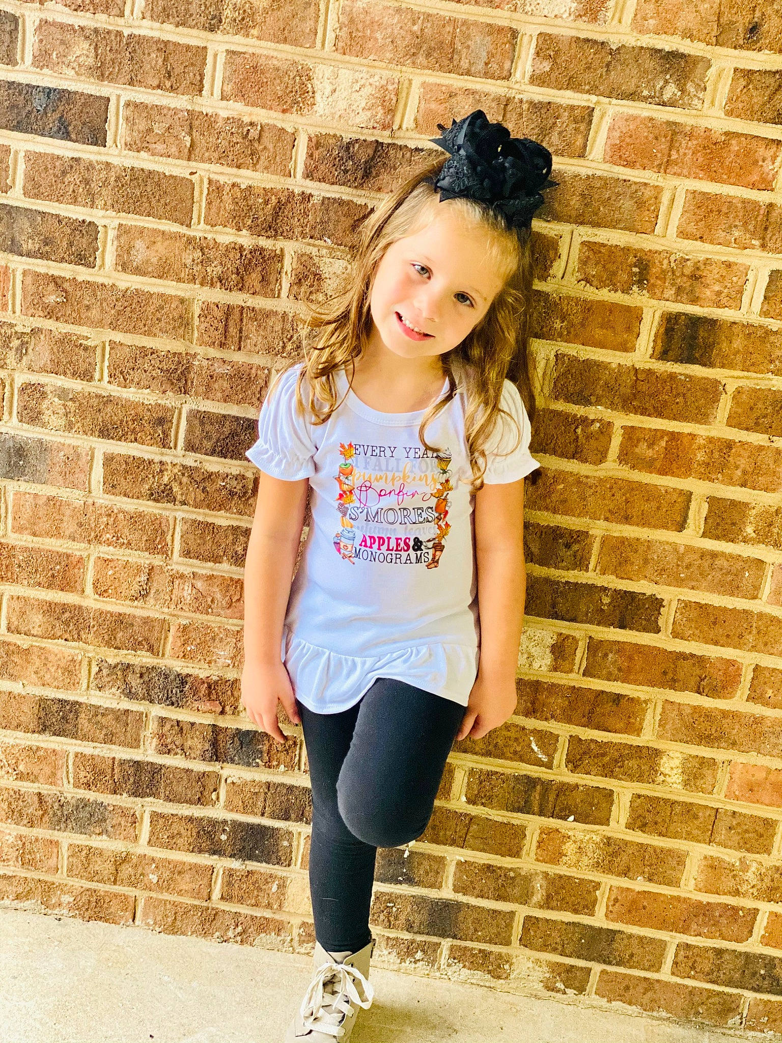 Ellie is registered to the contest to win money with this photo: brick, clothing, cool, fashion, flash_photography, hair, happy, joy, lip, neck, orange, person, pink, sleeve, smile, standing, street_fashion, sunglasses, t_shirt, textile