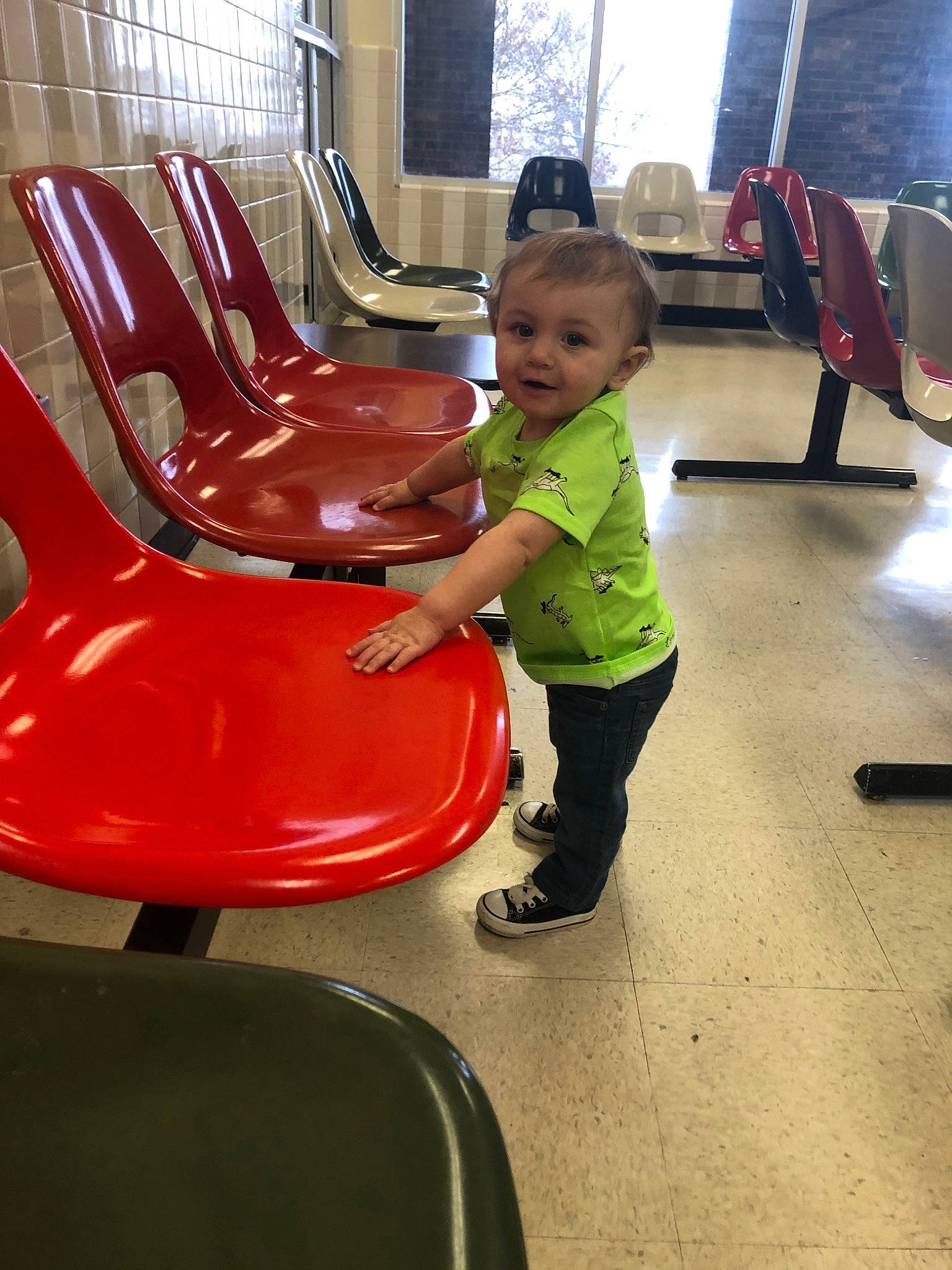 Fletcher is registered to the contest to win money with this photo: chair, child, fun, furniture, leisure, person, play, red, sitting, toddler