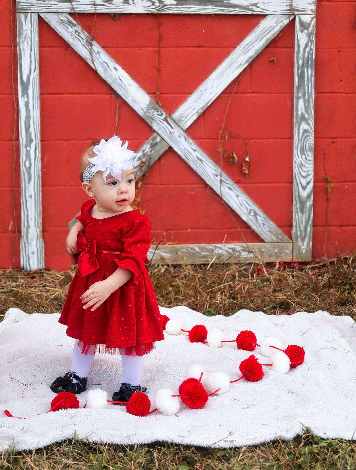 Adilynn is registered to the contest to win money with this photo: baby, baby_toddler_clothing, carmine, child, dress, event, face, grass, happy, headwear, human_body, magenta, pattern, people_in_nature, person, petal, pink, plant, red, rose_family
