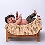 baby, infant, bed, knitted_blanket, wooden_furniture, cap, pants, bare_chest, hands, feet, curious, portrait, studio, white_background, child, cute, lying_down, small_bed, indoors, newborn