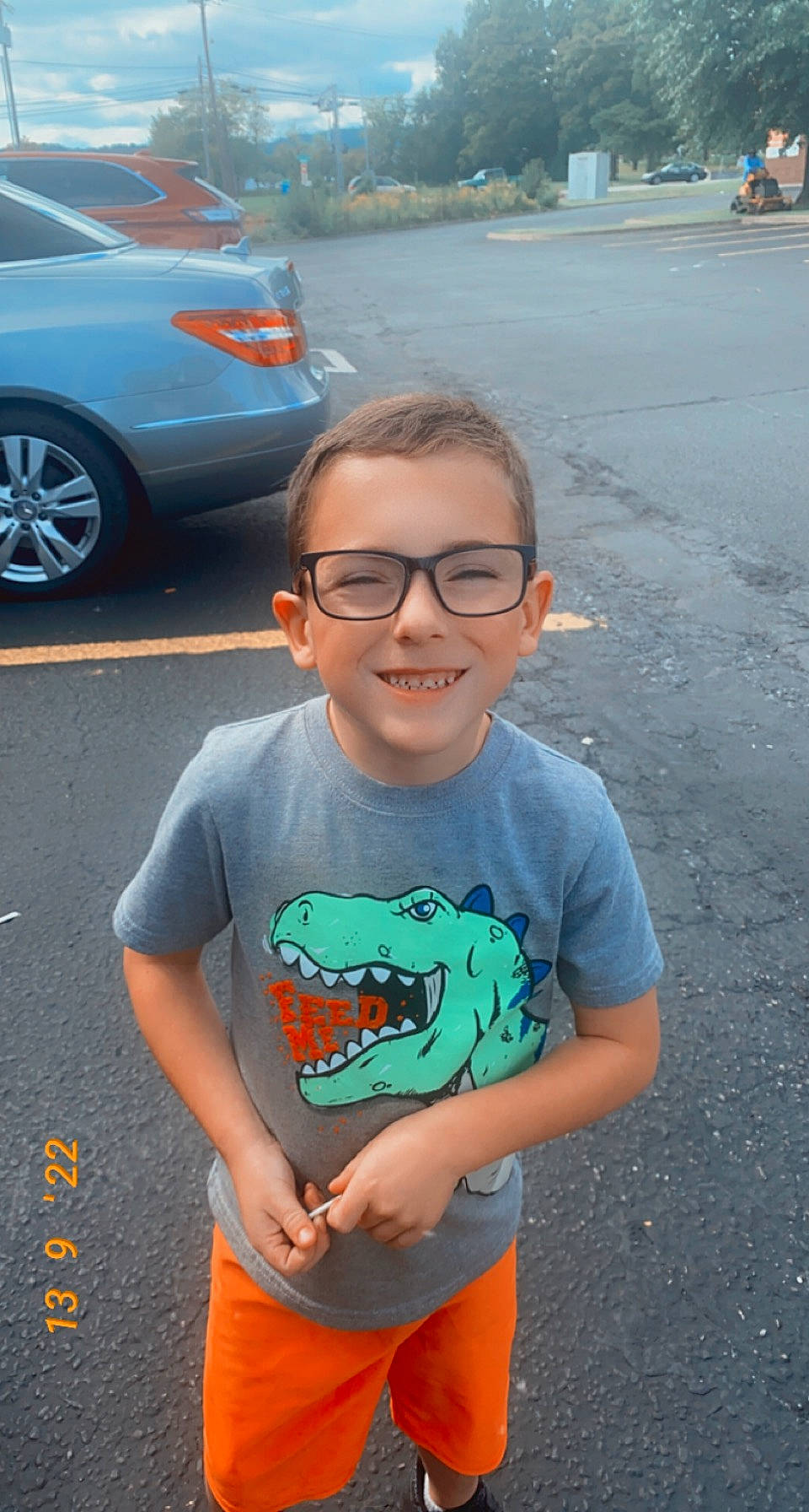 Mason joined the competition — help win amazing prizes! asphalt, automotive_design, automotive_exterior, automotive_lighting, automotive_tire, bumper, car, cool, eyewear, facial_expression, glasses, happy, hood, joy, motor_vehicle, person, sleeve, smile, tire, vehicle