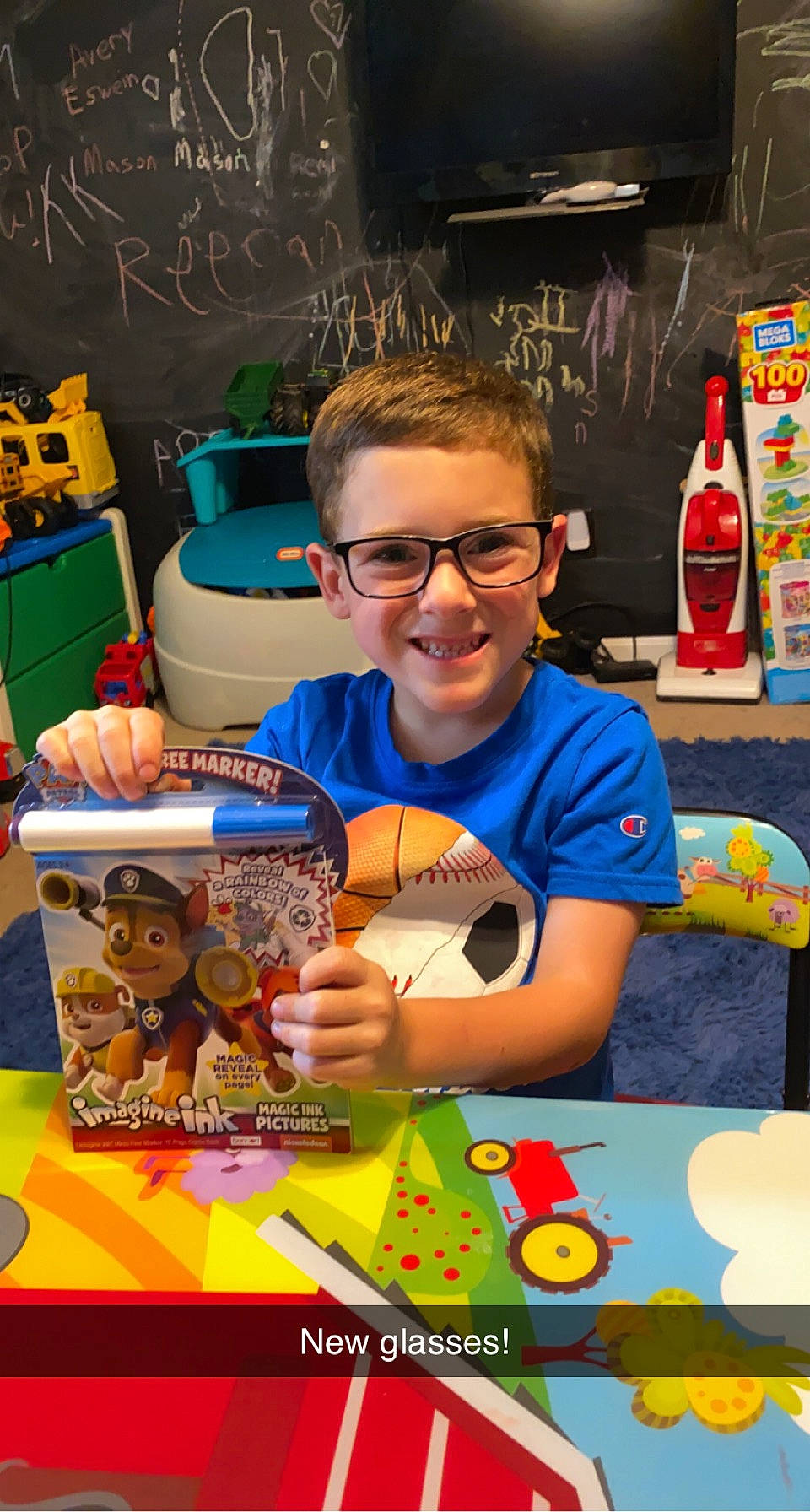 Mason is registered to the contest to win money with this photo: art, blackboard, child, event, eyewear, fun, games, indoor_games_and_sports, joy, lego, leisure, person, play, recreation, room, sharing, smile, stuffed_toy, toddler, toy