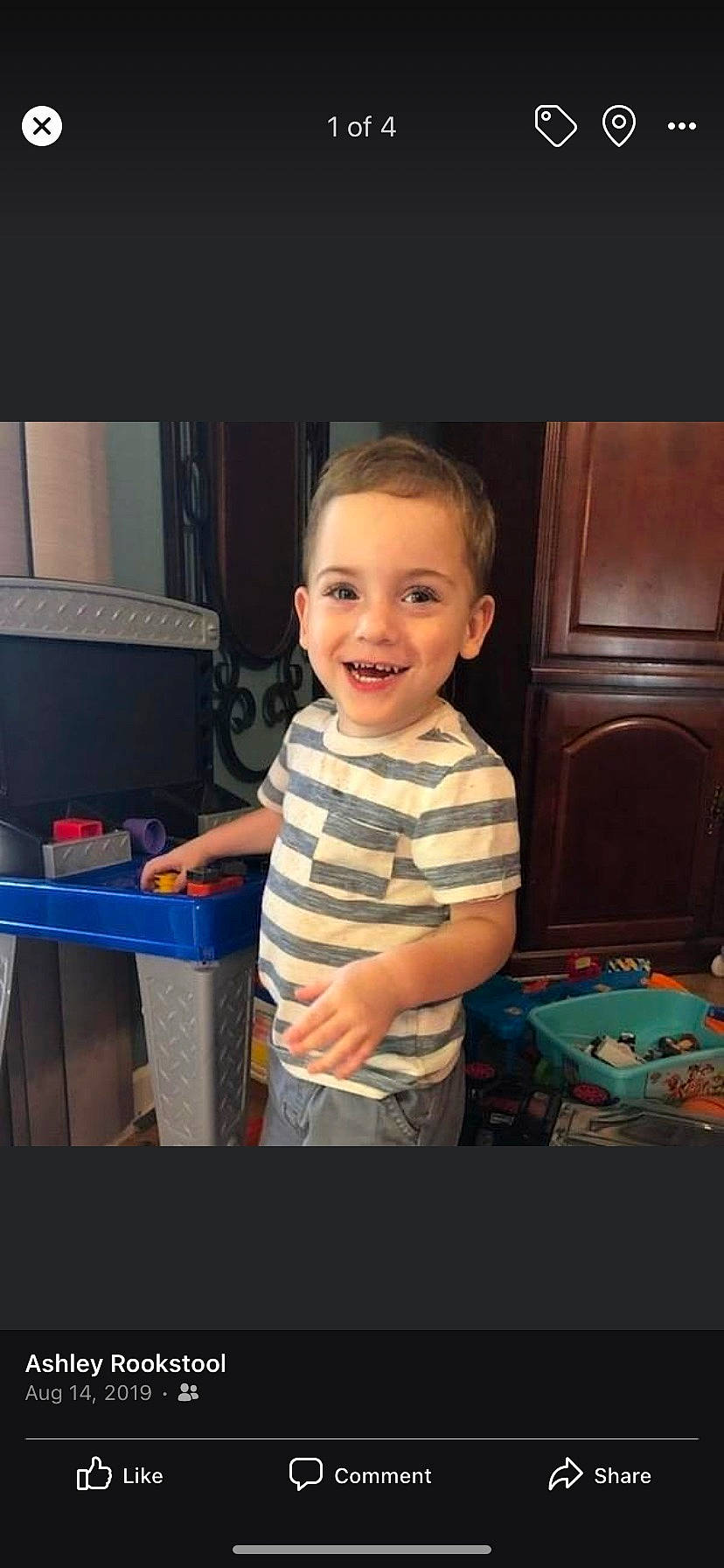 Mason is registered to the contest to win money with this photo: baby, cabinetry, child, drawer, electronic_device, flash_photography, fun, hairstyle, happy, iris, joy, party, person, play, recreation, room, sitting, smile, standing, t_shirt