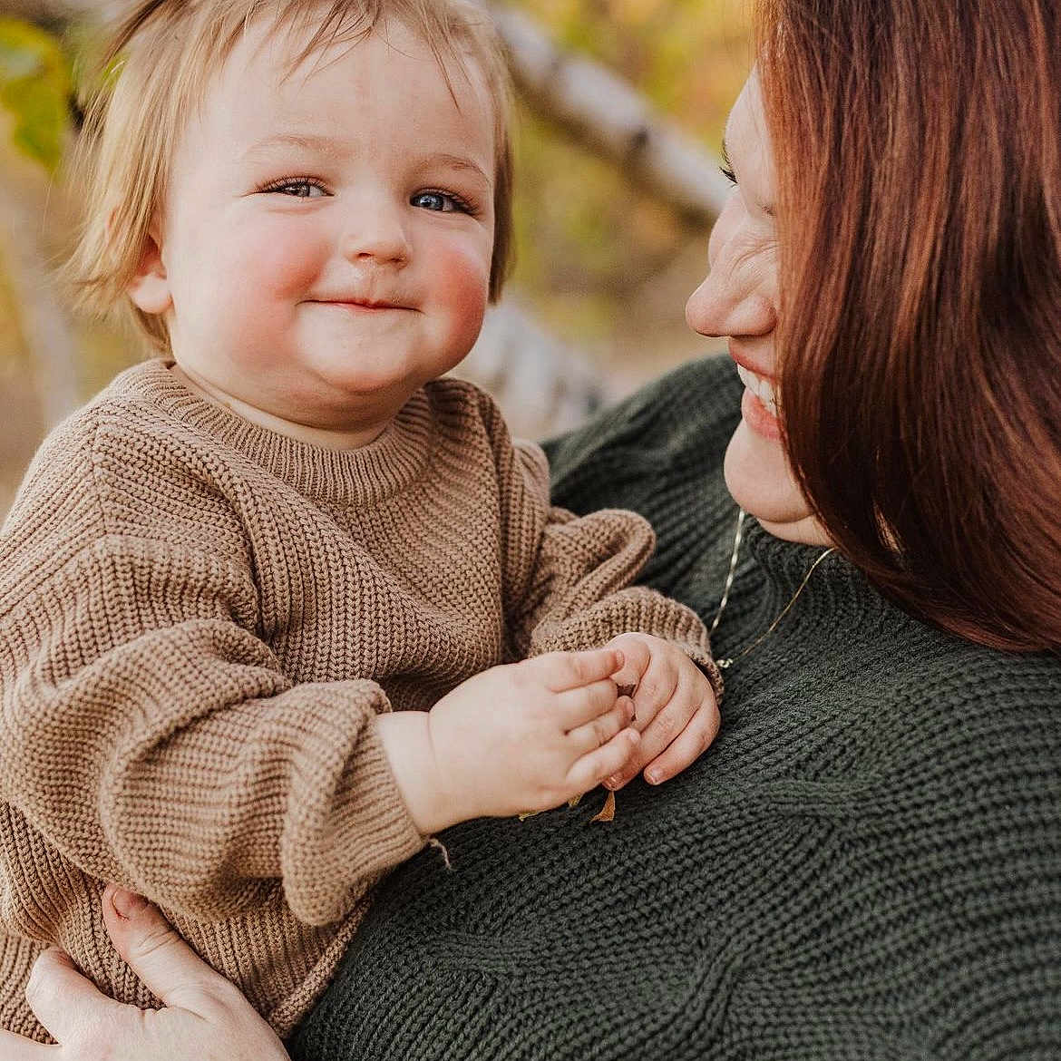 Isabella is registered to the contest to win money with this photo: accessories, baby, babylaughing, blonde, brownhair, clothing, face, hair, happy, head, jewelry, knitwear, laughing, necklace, people, person, photography, portrait, smile, sweater