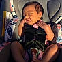 newborn, baby, car_seat, sleeping, infant, straps, floral_pattern, peaceful, cute, portrait, child, safety_harness, pink_clothing, indoors, closeup, foot, hand, hair, skin, relaxation
