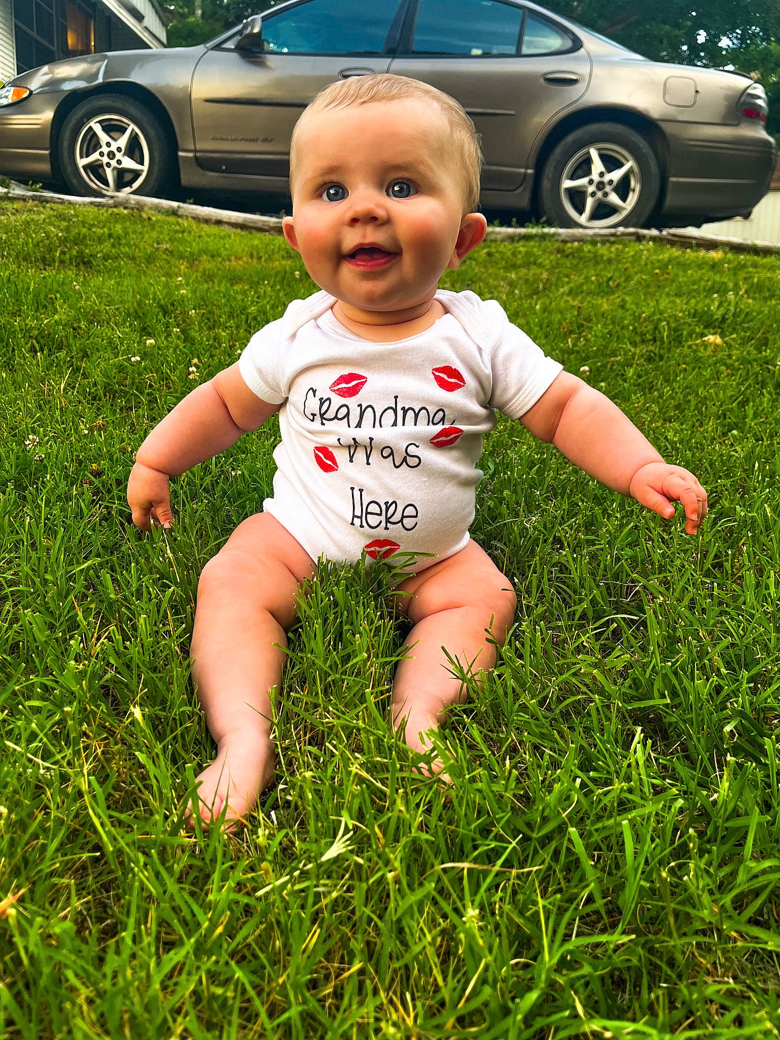 Kinsley Rose is registered to the contest to win money with this photo: automotive_design, automotive_exterior, baby_toddler_clothing, car, finger, grass, happy, light, mammal, motor_vehicle, people_in_nature, person, photograph, plant, smile, tire, toddler, vehicle, vehicle_door, wheel