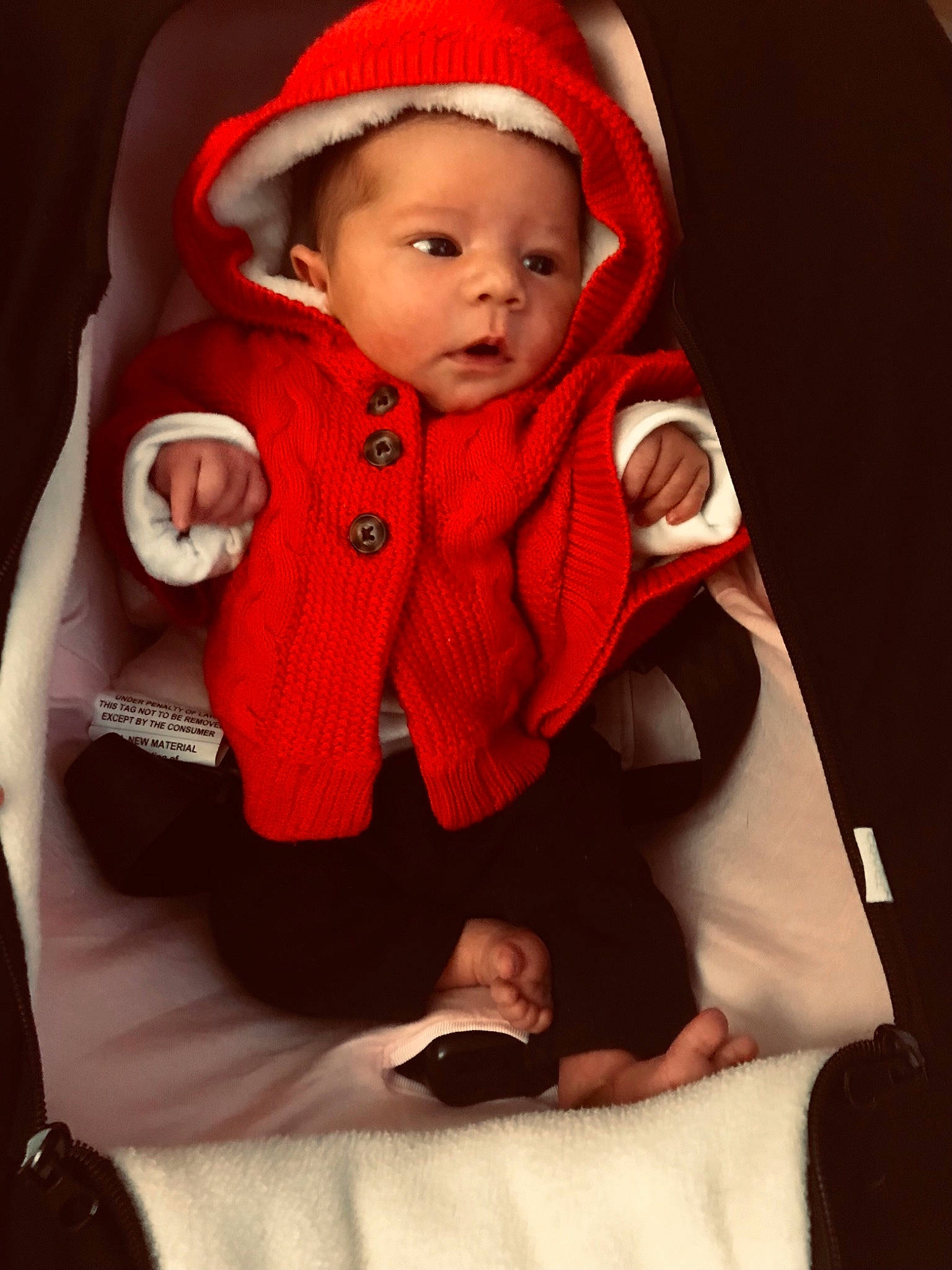 Kinsley joined the competition — help win amazing prizes! baby, baby_carriage, baby_products, baby_safety, baby_toddler_clothing, cap, carmine, child, comfort, face, facial_expression, fashion_accessory, hat, human_body, jacket, lip, person, sitting, skin, sleeve