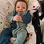 Joseph a rejoint le concours — aidez-le/la à gagner de superbes lots ! baby, infant, smile, onesie, fleece, baby_seat, polka_dots, toy, star, cozy, comfortable, child, cute, happy, hands, face, indoor, blanket, clothing, relaxing