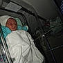 Joseph participe au concours pour gagner de l'argent avec cette photo : newborn, baby, hospital, bassinet, blanket, sleeping, hat, medical_equipment, infant, bed, cozy, indoors, person, resting, cute, child, wrapped, soft_lighting, healthcare, quiet