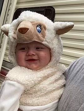 Grayson is registered to the contest to win money with this photo: baby, cap, cheek, child, ear, eye, fashion_accessory, fun, fur, fur_clothing, happy, headwear, hood, hoodie, nose, person, skin, sleeve, smile, toddler