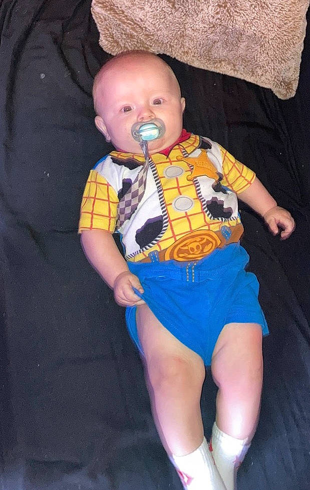 Grayson is registered to the contest to win money with this photo: baby, baby_products, baby_toddler_clothing, cheek, chin, comfort, electric_blue, eye, fun, head, human_body, human_leg, iris, leg, mouth, pattern, person, sleeve, t_shirt, thigh