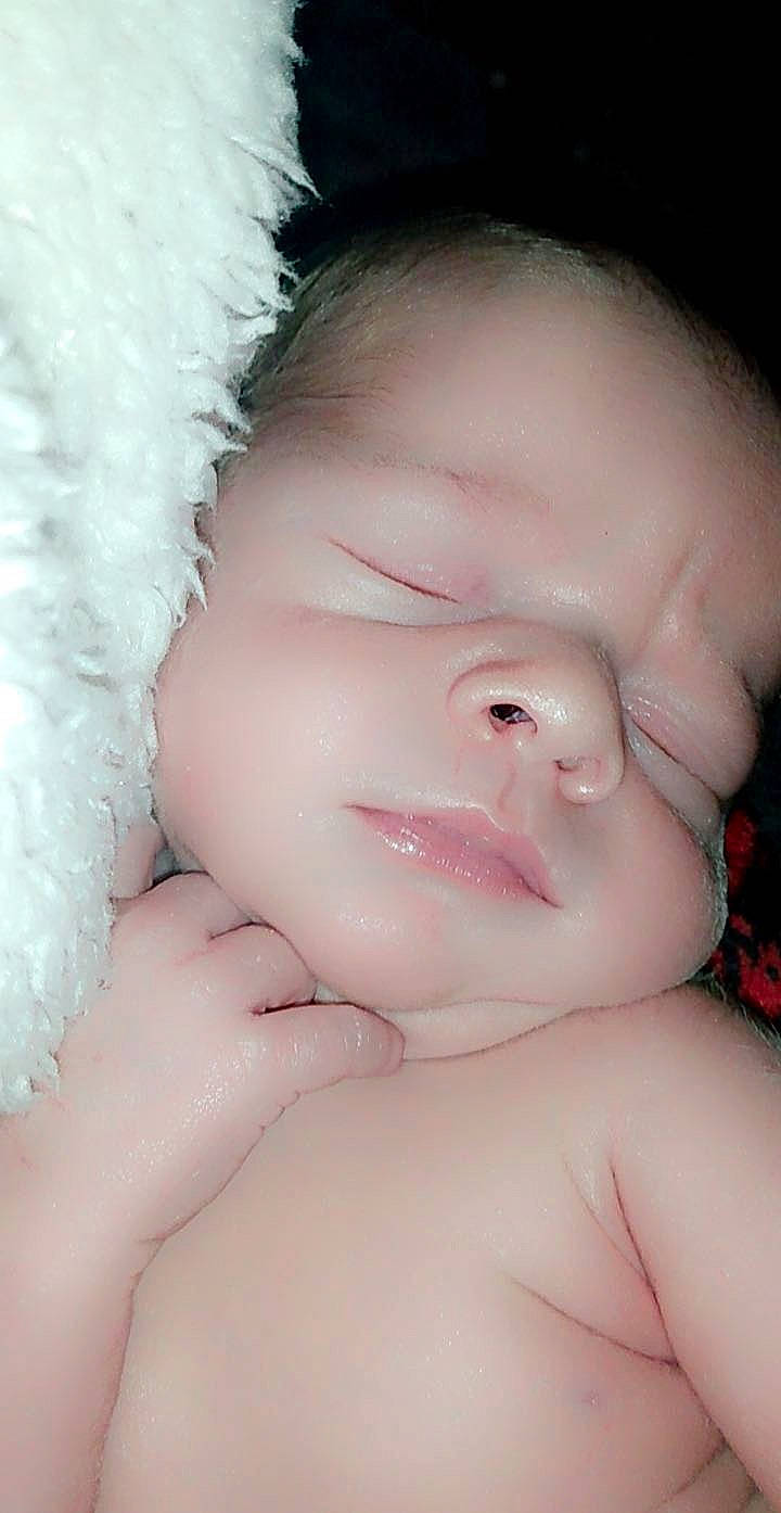 Grayson is registered to the contest to win money with this photo: arm, baby, cheek, chin, ear, eye, eyebrow, eyelash, face, finger, gesture, happy, head, human_body, iris, lip, mouth, neck, nose, person