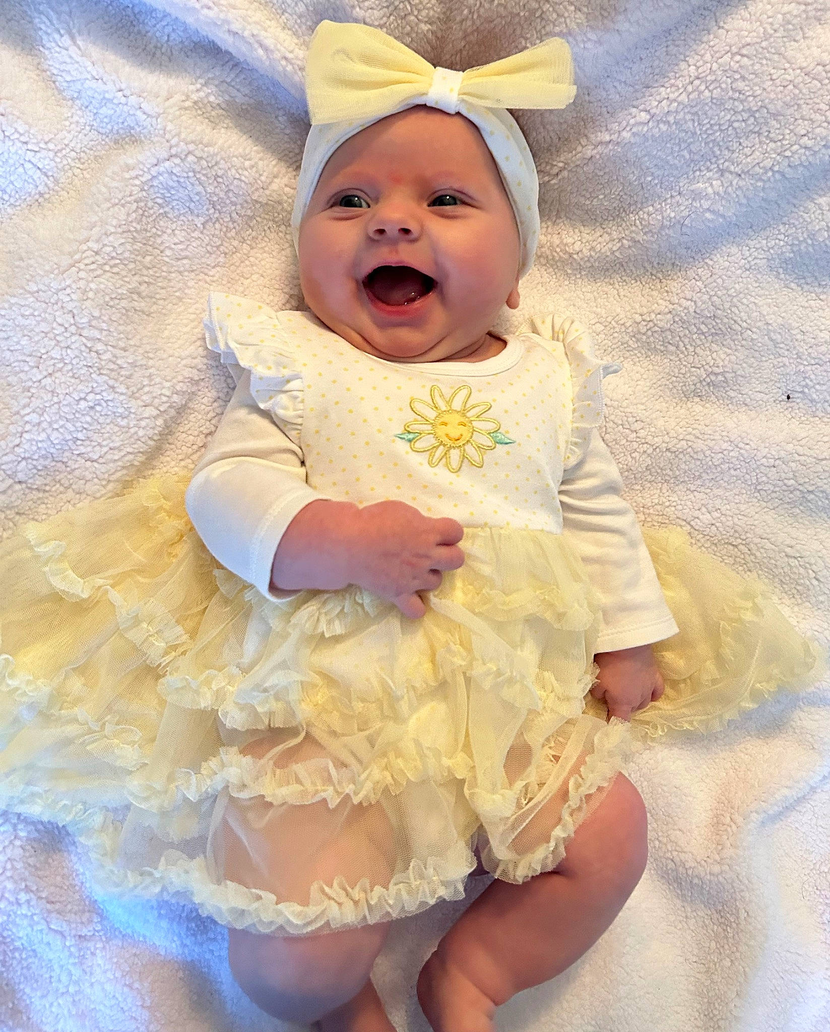 Lucy joined the competition — help win amazing prizes! baby, baby_toddler_clothing, child, costume_hat, day_dress, embellishment, face, fashion_accessory, fun, happy, headgear, iris, pattern, peach, person, pink, ruffle, skin, sleeve, smile