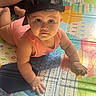baby, child, cap, crawling, floor, indoor, infant, looking_up, mesh_cap, patterned_mat, play_mat, portrait, skin, soft_light, toddler, toy_mat, wearing_clothes, young_child, curious, cute
