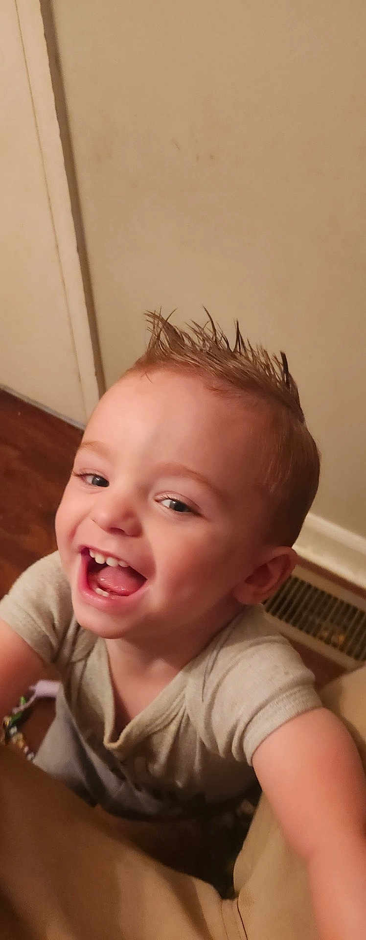 Junior is registered to the contest to win money with this photo: toddler, child, happy, smiling, indoor, person, spiky_hair, cute, joyful, short_sleeve_shirt, face, young, skin, cute_expression, playful, closeup, baby, head, mouth_open, teeth