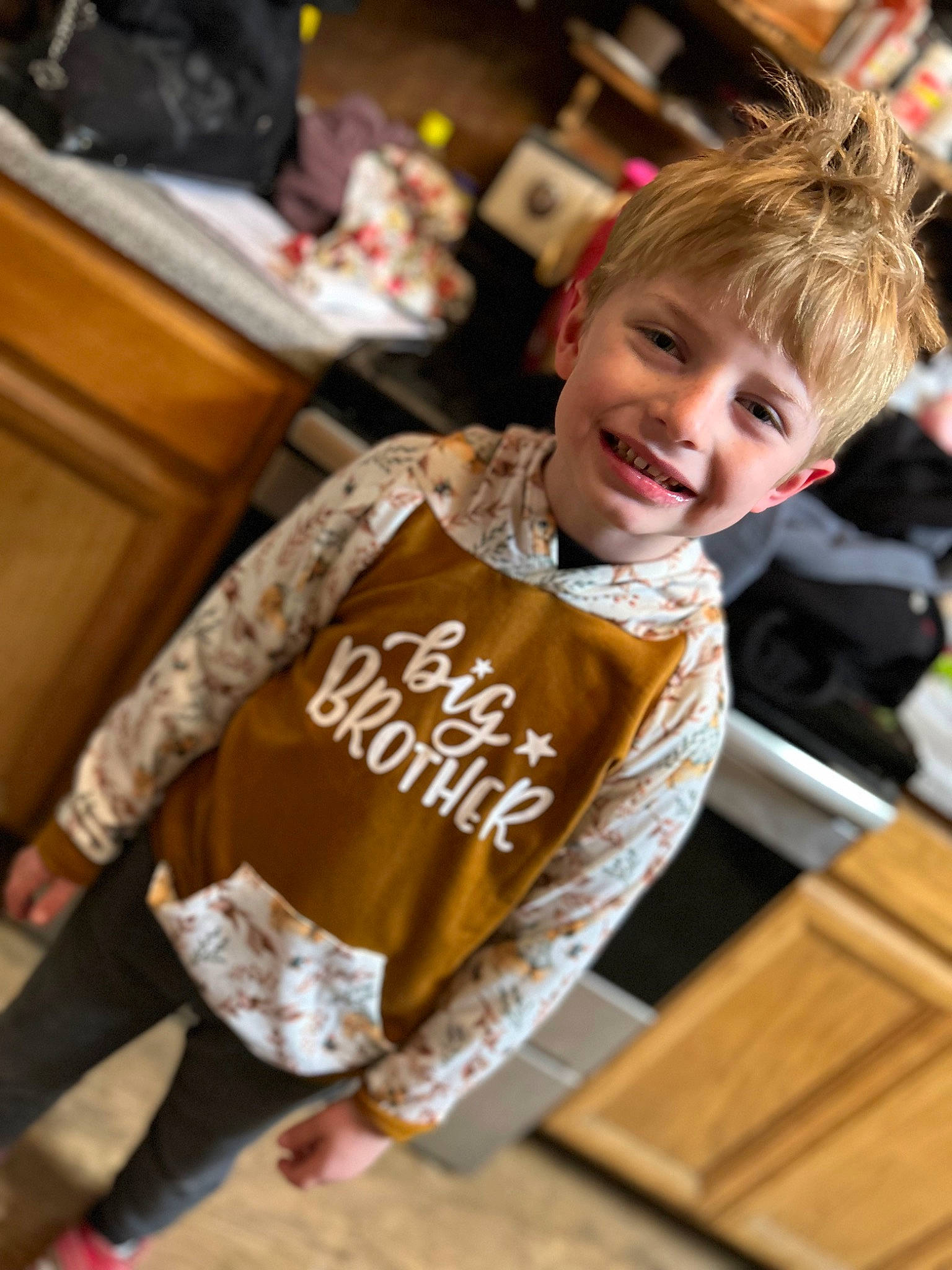 Colby joined the competition — help win amazing prizes! chair, child, floor, flooring, fun, fur, happy, hardwood, joy, leisure, person, play, recreation, room, sitting, sleeve, smile, sportswear, t_shirt, toddler