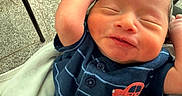 Yadiel joined the competition — help win amazing prizes! newborn, baby, infant, sleeping, face, portrait, smiling, stretching, arms_up, blue_outfit, striped_clothing, car_design, blanket, stroller, indoor, tile_floor, close_up, happy, cute, photography