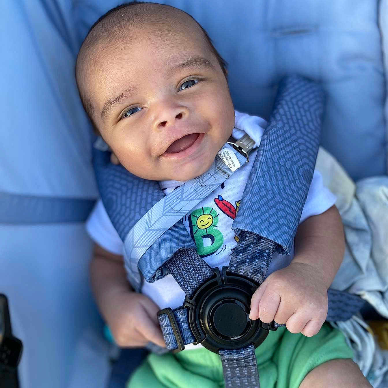 Leighton is registered to the contest to win money with this photo: accessories, baby, babylaughing, belt, camera, clothing, electronics, face, happy, head, newborn, pants, person, photography, portrait, selfie, sitting, sleeve, smile, strap