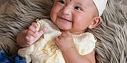 Zanaya is registered to the contest to win money with this photo: baby, candid, child, closeup, cute, denim_pants, earrings, fashion, floor, fluffy_rug, hands, happy, headband, indoor, infant, lying_down, portrait, skin, smiling, yellow_top