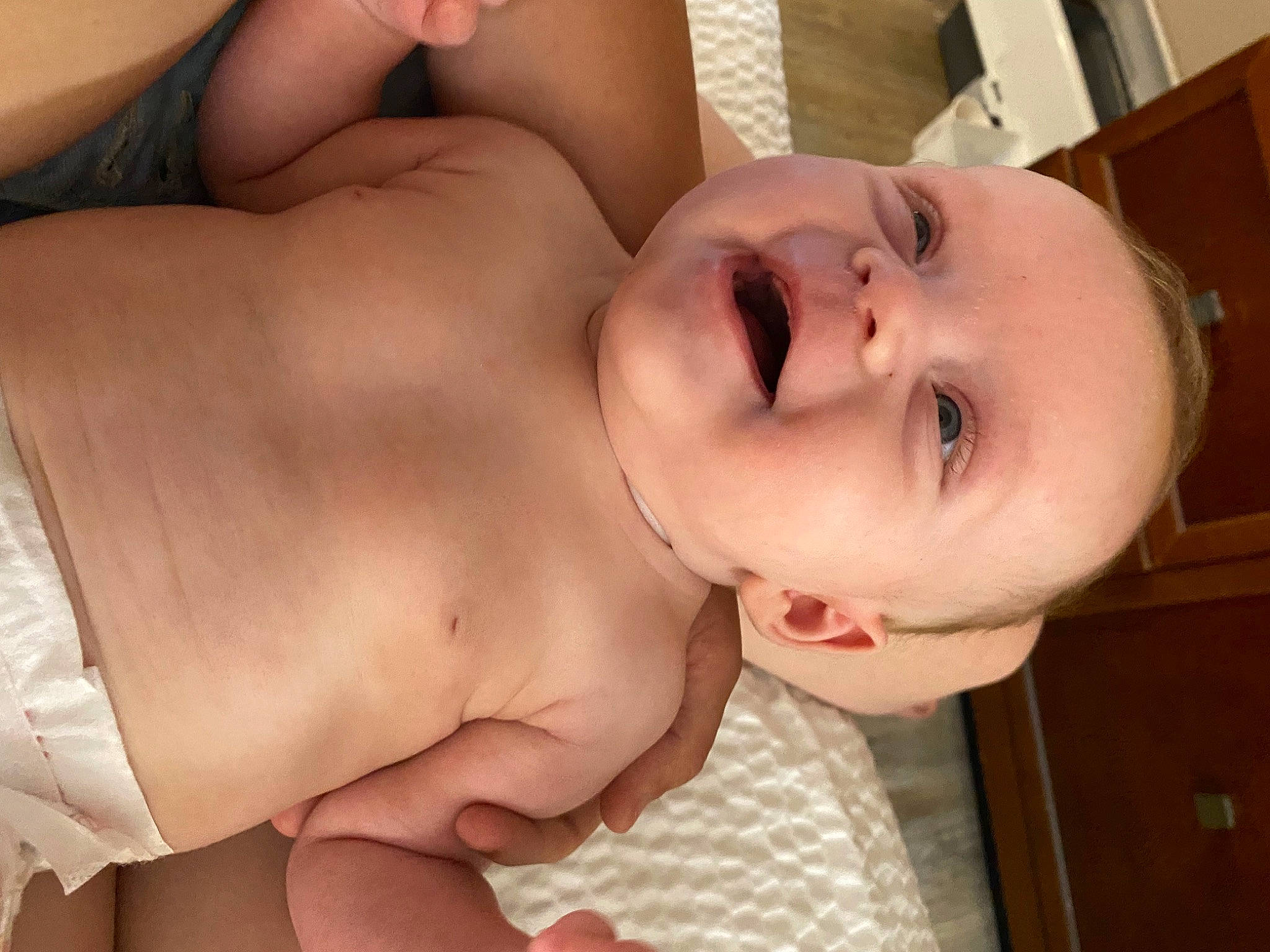 Adaline is registered to the contest to win money with this photo: abdomen, baby, cheek, chest, child, eyelash, facial_expression, finger, hand, head, lip, mouth, neck, nose, person, skin, smile, stomach, thumb, toddler