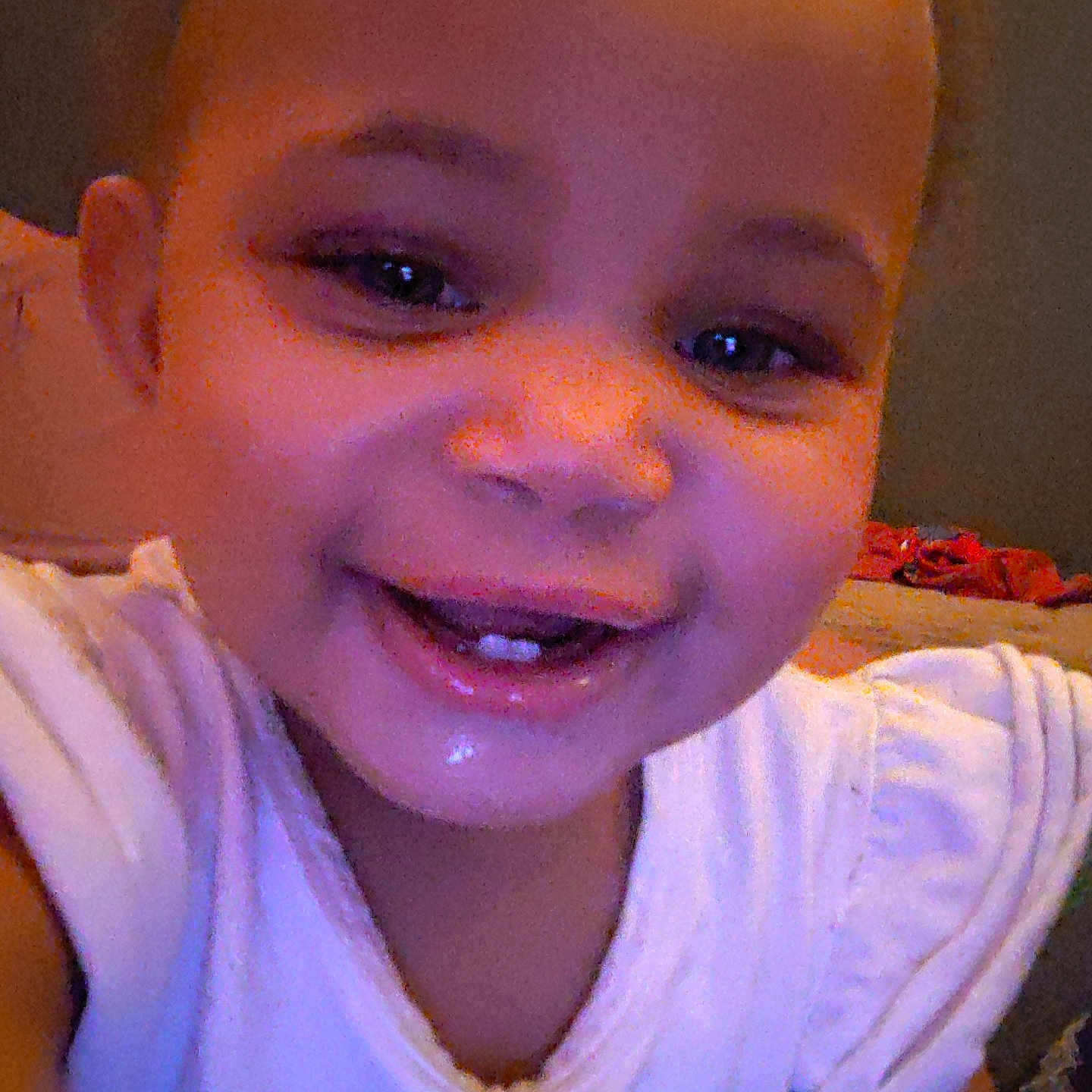 Kalani is registered to the contest to win money with this photo: child, toddler, smiling, face, teeth, white_shirt, indoor, happy, portrait, closeup, baby, person, cute, skin, head, expression, young, childhood, fun, joy