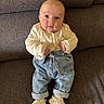 Romy a rejoint le concours — aidez-le/la à gagner de superbes lots ! baby, infant, child, sweater, jeans, booties, couch, furniture, indoor, portrait, cute, clothing, knitwear, seated, looking, expression, casual, comfortable, cozy, home