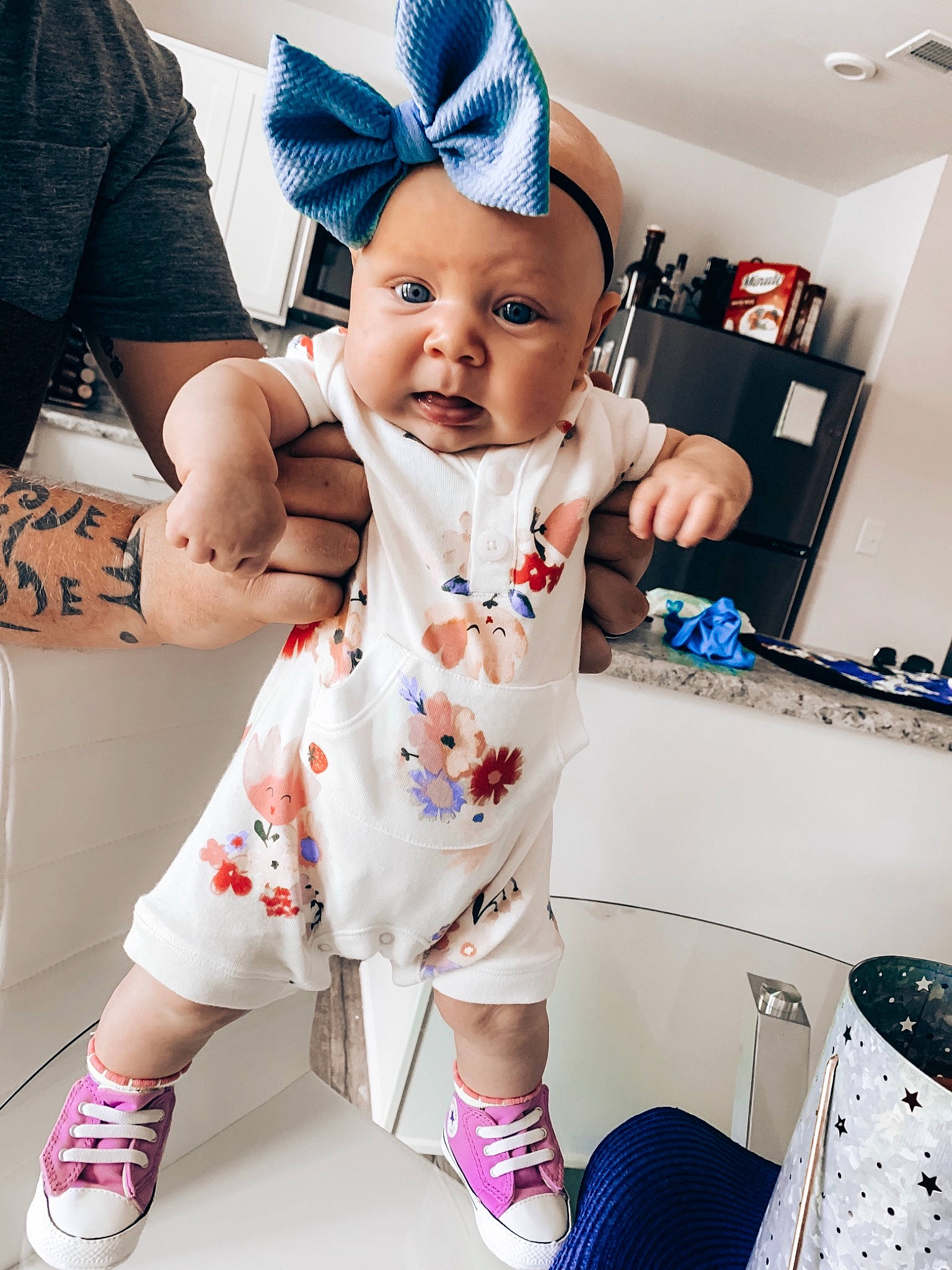 Kirra is registered to the contest to win money with this photo: arm, baby, baby_toddler_clothing, child, cool, daughter, ear, headgear, outerwear, person, product, shoe, sleeve, smile, t_shirt, toddler