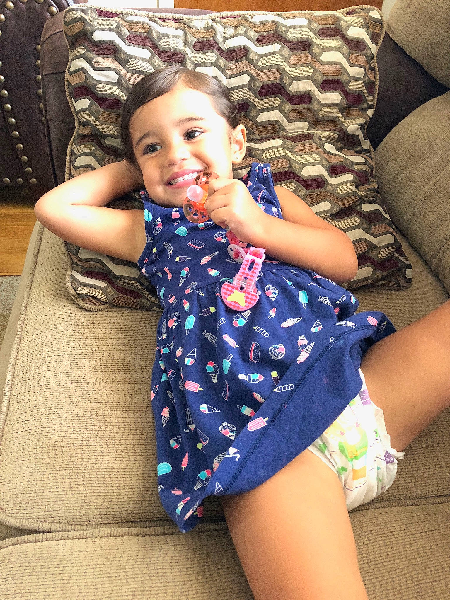 Aiyanna is registered to the contest to win money with this photo: abdomen, arm, beauty, child, dress, fun, happy, human_leg, joint, joy, leg, person, shoulder, sitting, skin, smile, summer, thigh, toddler, trunk