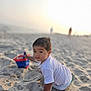 Adan is registered to the contest to win money with this photo: beach, boy, bucket, child, coast, crawling, face, head, male, nature, outdoors, person, photography, portrait, sand, sea, shoreline, sky, summer, water