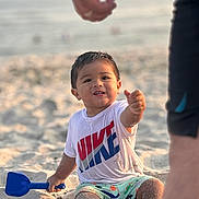 Adan joined the competition — help win amazing prizes! beach, bodypart, boy, child, clothing, coast, face, finger, hand, head, nature, outdoors, person, photography, portrait, sea, shoreline, shorts, t_shirt, water
