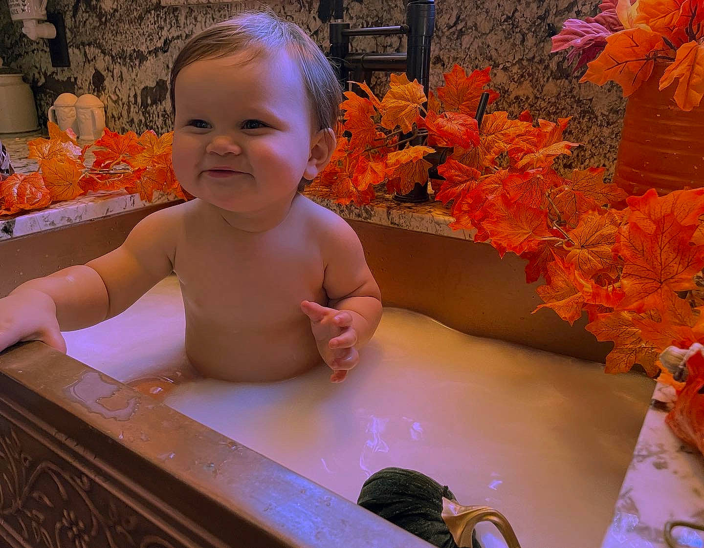 Kruz is registered to the contest to win money with this photo: baby, baby_toddler_clothing, child, craft, cut_flowers, eye, floral_design, floristry, flower_arranging, fun, hair, happy, joy, leisure, orange, person, plant, sitting, smile, table