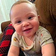 Jeriah joined the competition — help win amazing prizes! arm, baby, blanket, casual, child, closeup, clothing, comfort, couch, expression, eyes, face, happy, head, home, indoor, infant, person, portrait, smiling