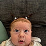 Storey joined the competition — help win amazing prizes! baby, child, face, wide_eyes, pigtails, hair_ties, bib, clothing, infant, cute, portrait, expression, indoors, sitting, closeup, skin, head, mouth_open, background, soft_texture
